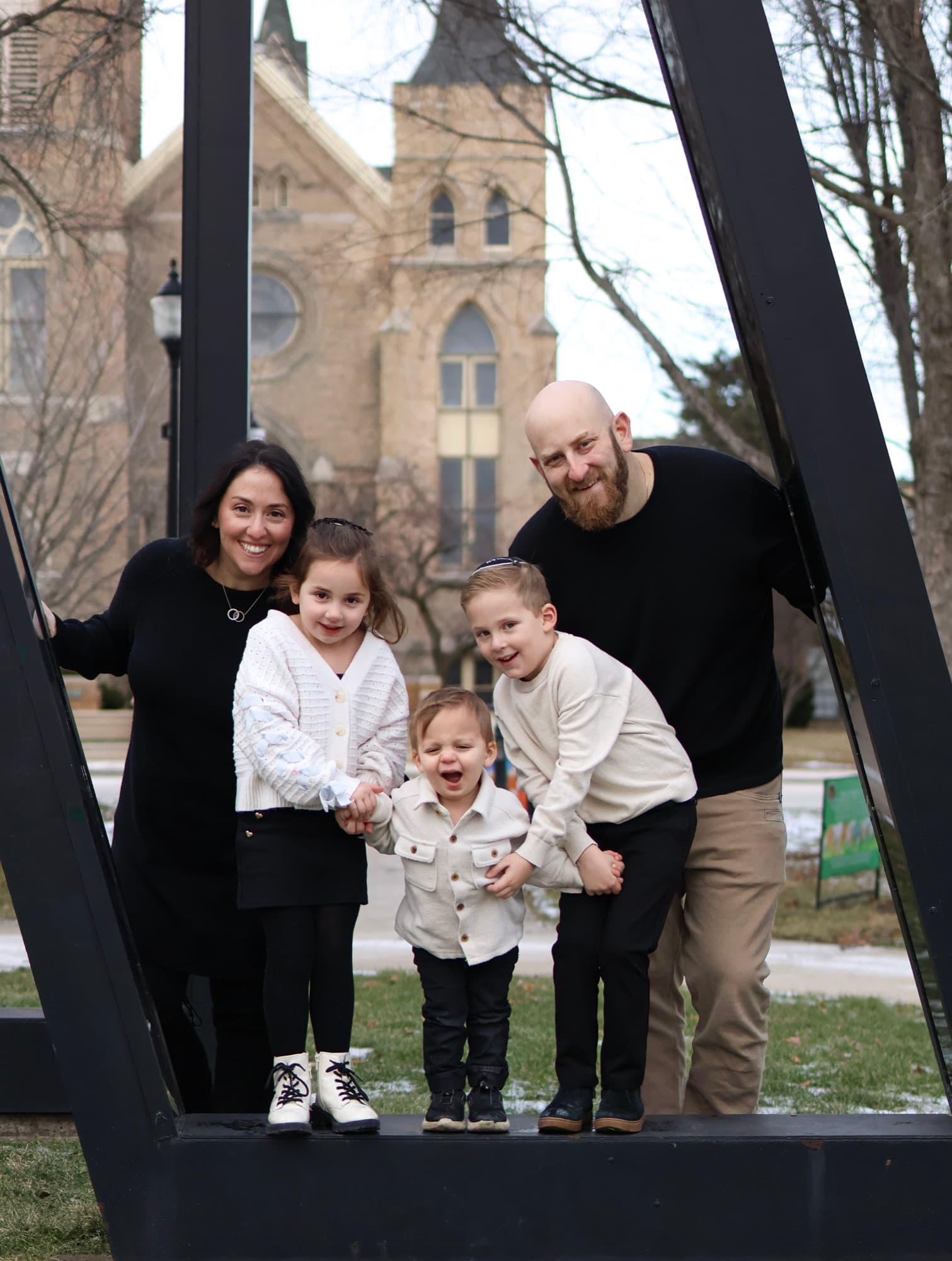 Family portrait by sculpture outside Skokie Library — outdoor family photography