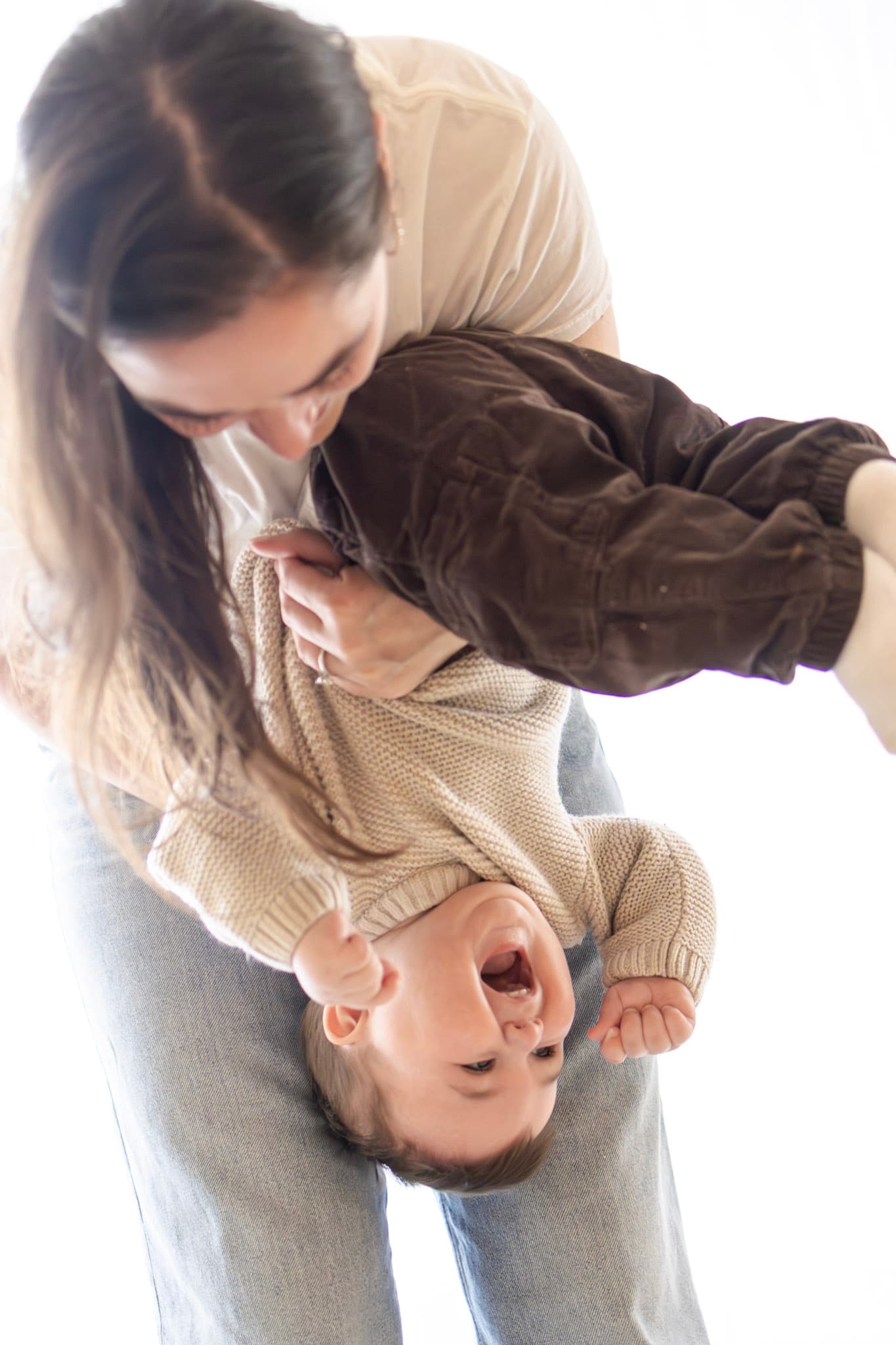 Parent and baby connection during natural light in-home family photography in West Rogers Park