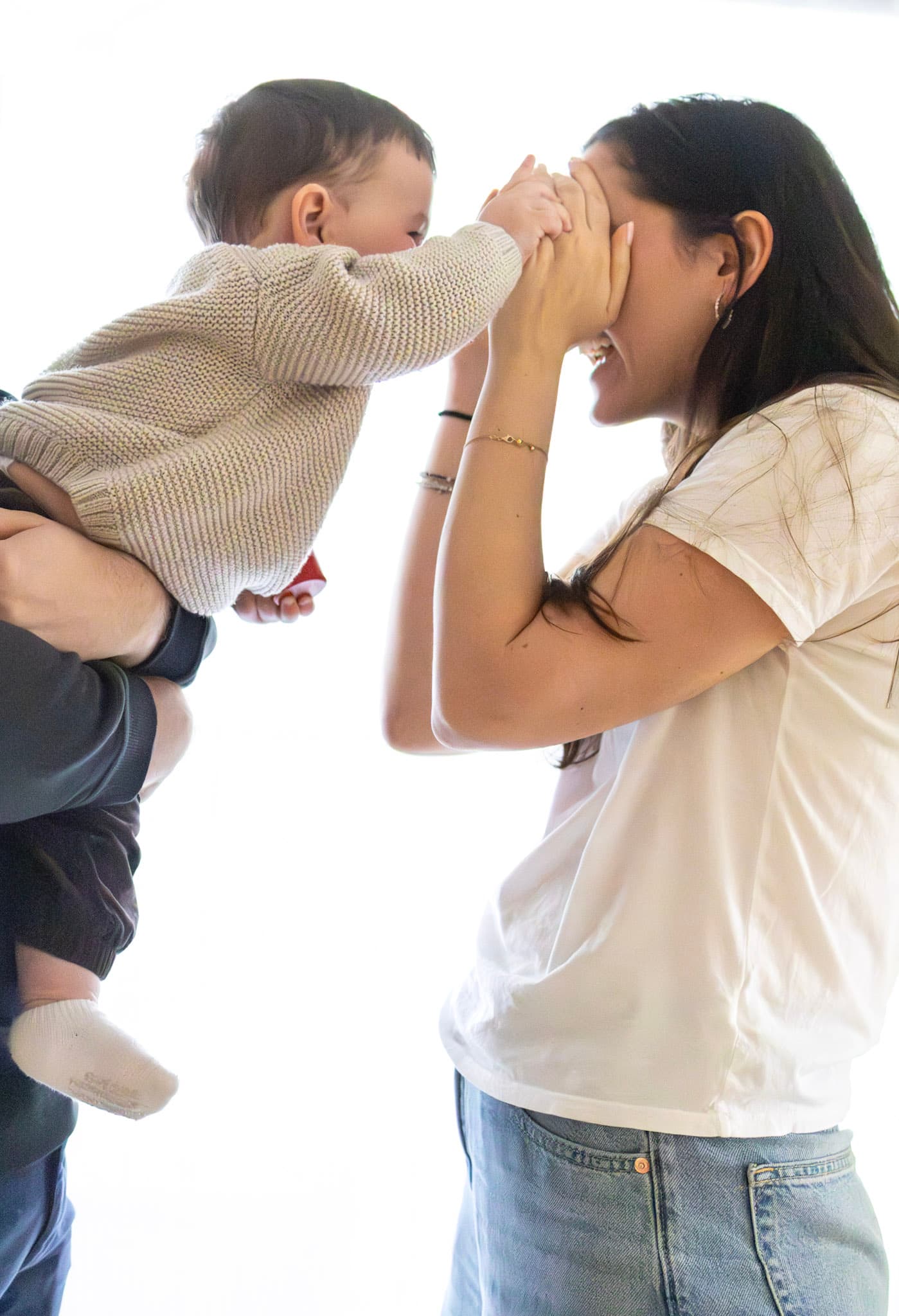 Candid family moment with a 9 month old baby during an in-home lifestyle session in Chicago