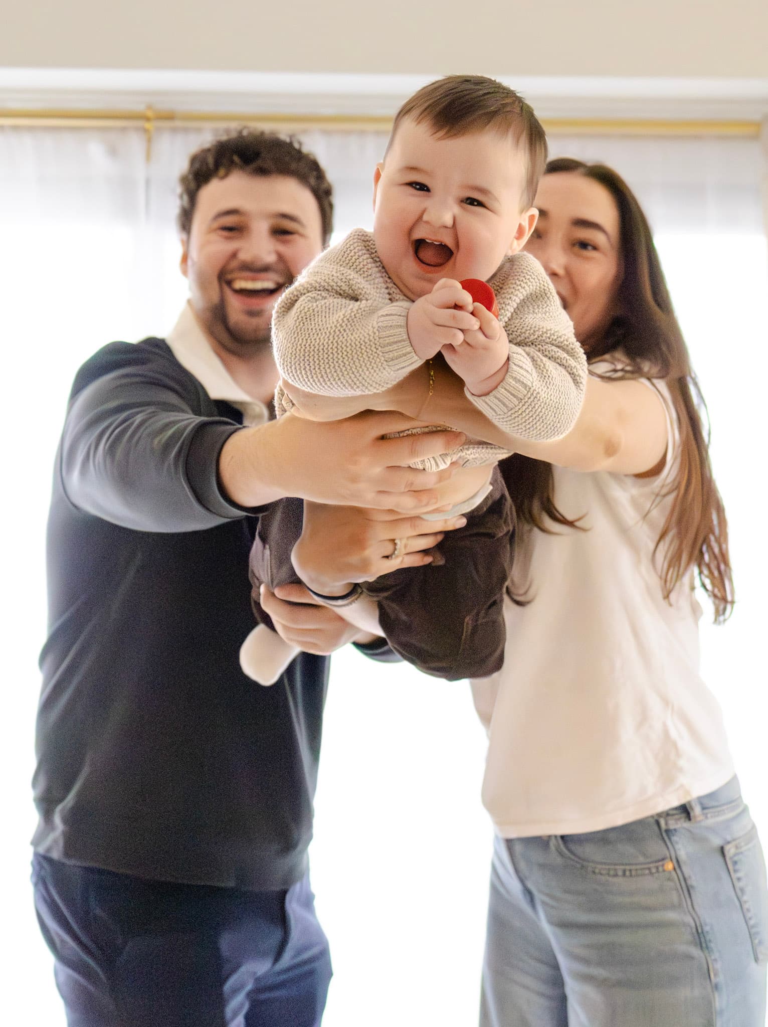 Baby playing at home during a West Rogers Park family photography session
